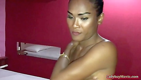 Asian brunette with a nice round booty fucking in her hole