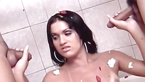 Two horny studs fuck a cute shemale in a threesome